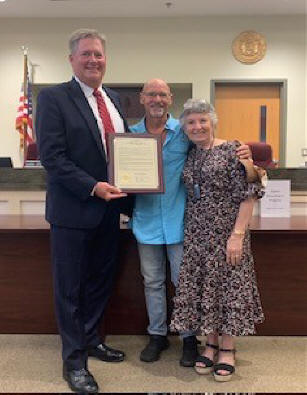 Supervisor Kusnierz (left), Kenny T (center), and Reverend Patti Girard (right).